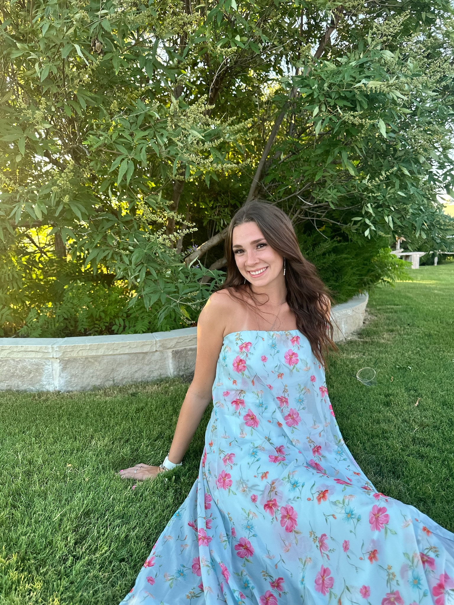 a girl standing in a garden